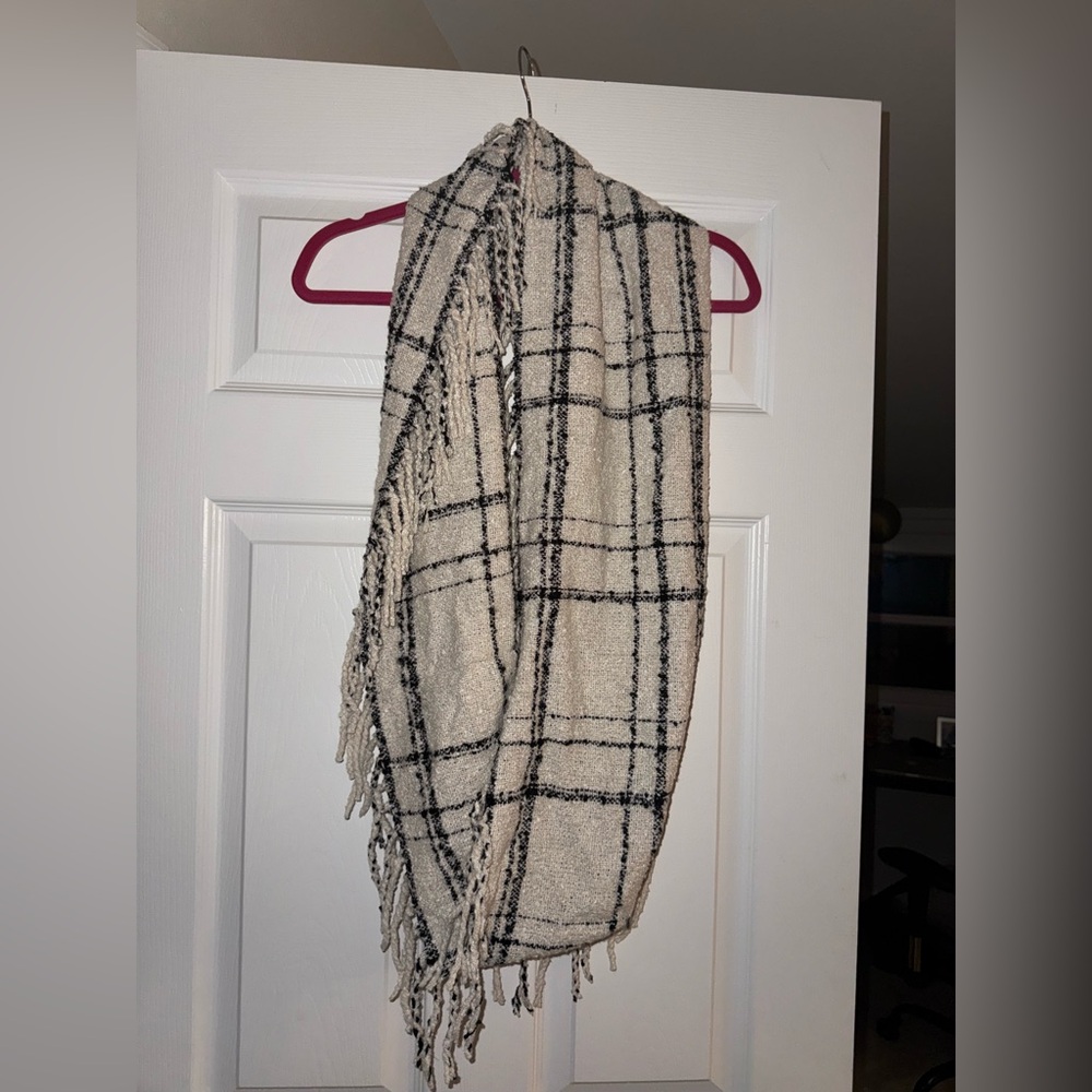 Infinity scarf with fringe detail. NWOT Black and beige plaid 100% polyester